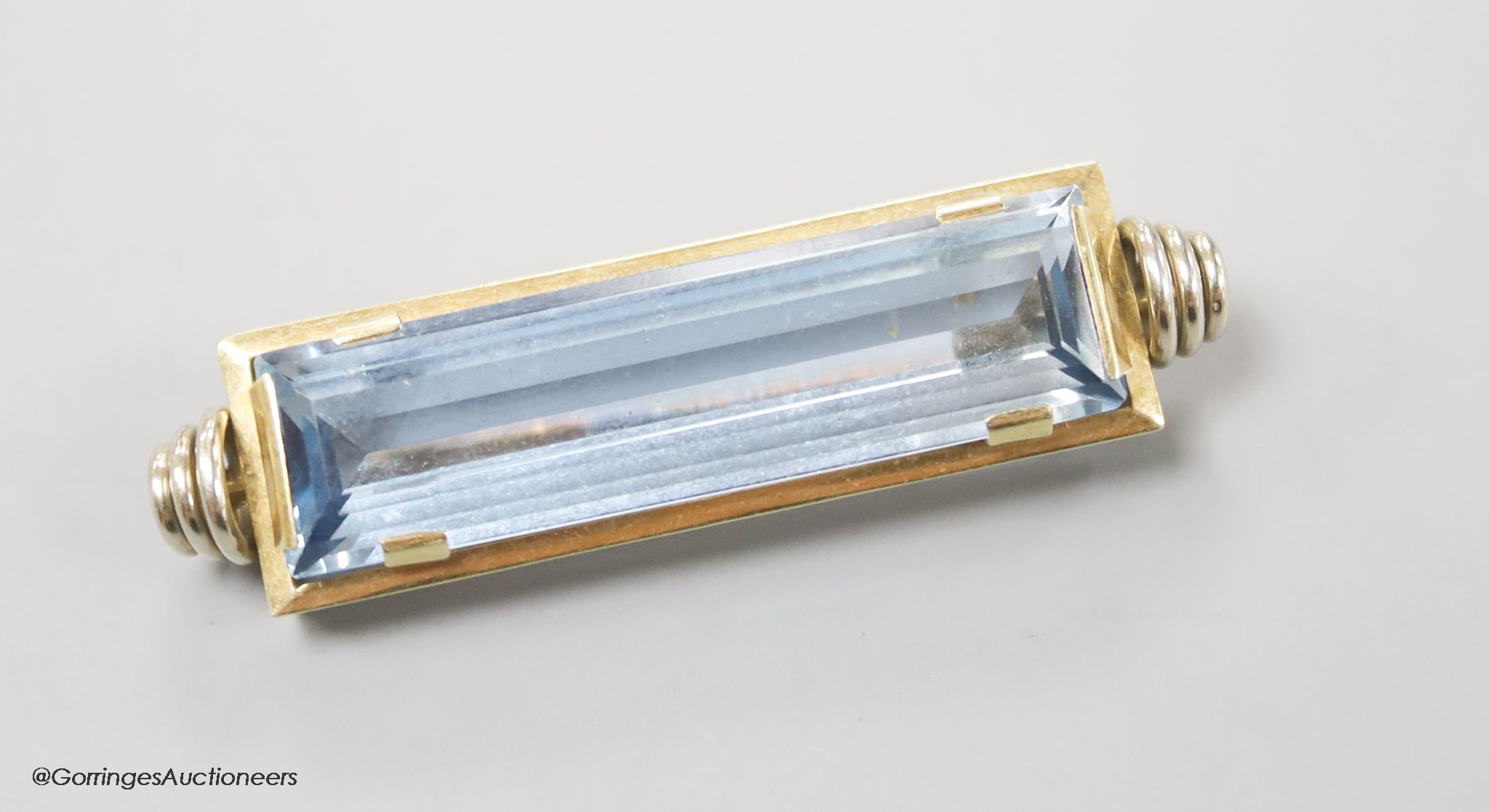 A modern 585yellow metal and blue paste set rectangular brooch, 47mm, gross 13 grams.